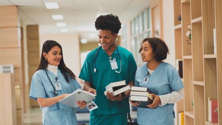 LPN students with textbooks studying for NCLEX PN