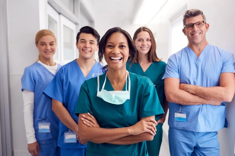 nurses smiling standing group