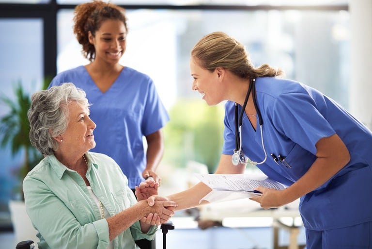 nurses talking to woman about health